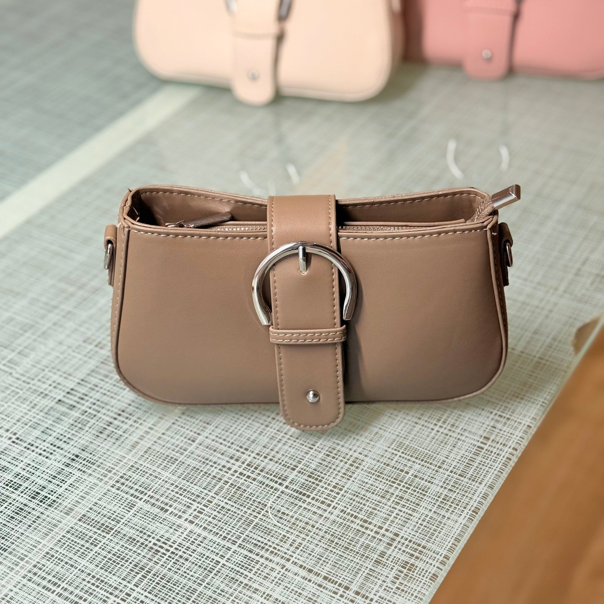 Brown handbag with a silver buckle 